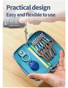 Custodia per chiavi in pelle blu con sei ganci metallici e scomparto per carte