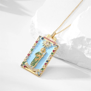 Detailed shot of vintage gold-plated rectangle pendant with colorful gemstones and enamel