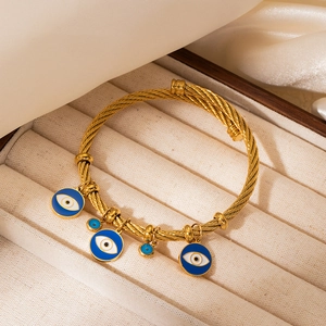18K gold-plated stainless steel twisted cable bangle with blue enamel evil eye charms