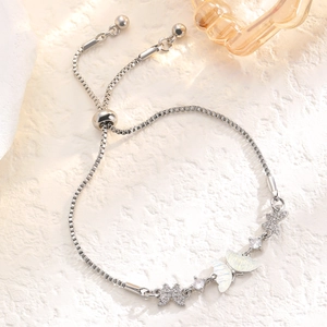 Detail of silver butterfly bracelet with adjustable bolo clasp and zircon accents