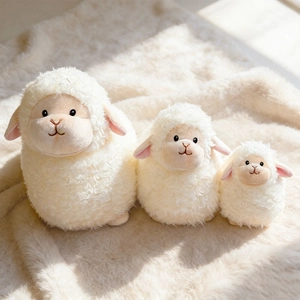 Three-piece set of chubby white plush sheep dolls in various sizes on a soft rug