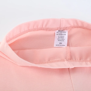 Pink cotton girls leggings with 95% cotton tag and elastic waist detail