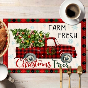 Christmas place mat with red truck and plaid pattern on rustic white wood table