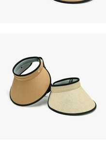 Detailed straw weave texture of khaki and beige sun visors with black edge binding