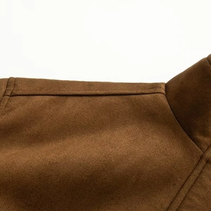 Macro shot of brown faux suede jacket collar showing high-quality stitching detail
