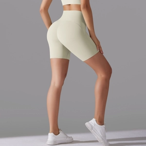 Close-up of high-waist cream white yoga shorts showing seamless butt-lifting fit