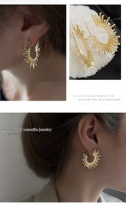 Detail view of golden bohemian sunburst earrings featuring irregular geometric sun flower petals