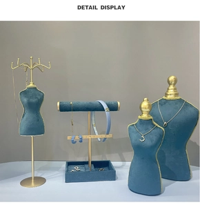 Peacock blue velvet jewelry stands with matte gold frames for necklace and earring display