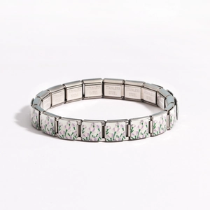 Detail view of stainless steel modular link bracelet with purple tulip floral patterns