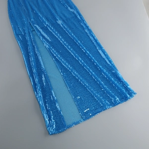 Detail shot of blue sequin fabric texture and high side slit design on a midi dress