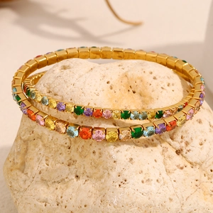 Detailed view of 18K gold plated stretch bracelets with colorful zircon stones on stone