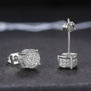 Macro shot of silver iced out round stud earrings with shimmering white zircon stones