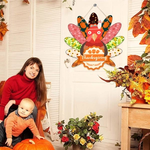 Thanksgiving turkey wooden door sign with autumn pumpkins and cozy festive family background