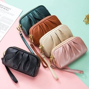Collection of retro pleated leather clutches in five colors with gold zippers and wristlets
