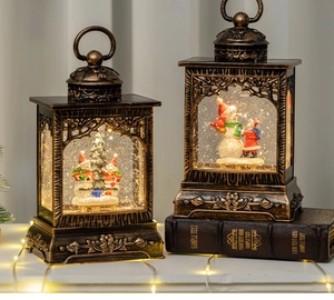 Close-up of vintage bronze Christmas lanterns with glowing snow globe and festive scenes