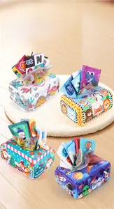 Set of four colorful baby tissue box toys featuring dinosaur and space themes on soft fabric