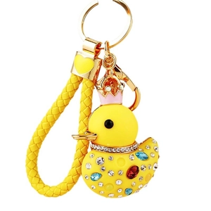 Sparkling rhinestone yellow duck keychain with pink crown and braided leather strap