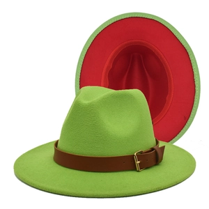 Detail of green and red bicolor wool fedora with brown leather belt and gold buckle