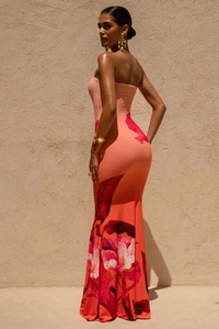 Detail of orange-pink floral tube dress showing body-con fit and large floral pattern