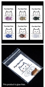 Macro shot of natural crystal fish stones with Purr-fect Pair cards in clear packaging