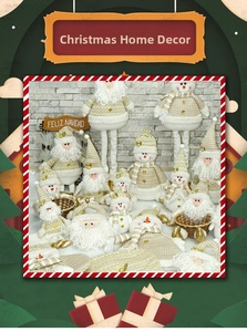 Detailed view of knitted Santa and Snowman plush figurines in cream and gold colors