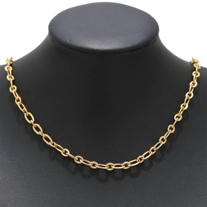 Detailed view of textured 18K gold-plated oval chain links on a black mannequin