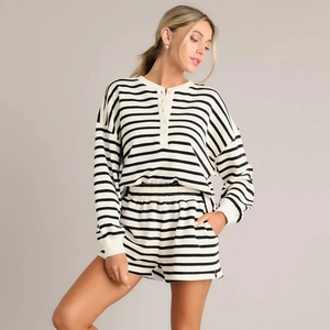 Close-up of the striped knit long-sleeve top and elastic shorts set texture