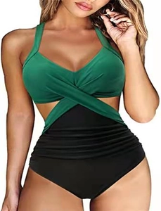 Detail of cross-wrap monokini with green bodice and black high-waist ruched bottom
