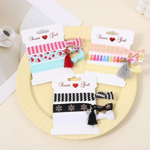 Set of 9 Korean style floral and patterned elastic hair ties on white display cards