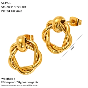 Detail of 15mm double-layer twisted 18k gold plated stainless steel knot earrings