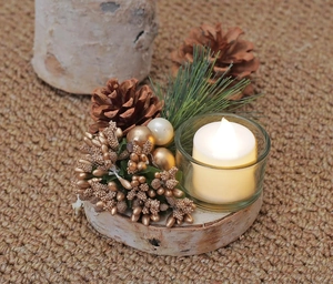 Christmas candle holder with wooden base, glass cup, golden berries and pine cones décor