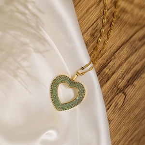 18K gold plated heart pendant necklace with green zircons on white silk and wood