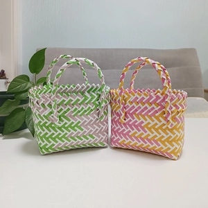 Detail of colorful hand-woven plastic mini gift bags for summer and celebrations