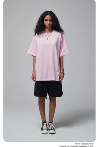 Front full-body shot of a pink oversized cotton t-shirt for men with a relaxed fit