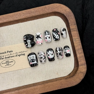 Handmade 3D Halloween press-on nails with dark cat design and silver glitter finish