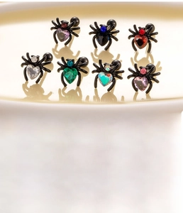 Detailed specs of spider cartilage studs with colorful zircons and titanium steel bars