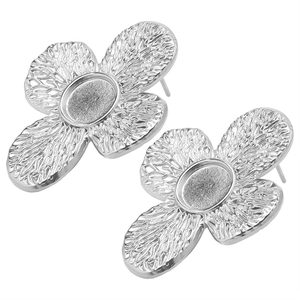 Detail of silver 304 stainless steel flower earrings with textured hammered finish