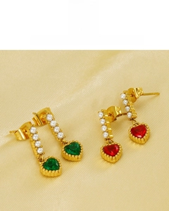 Detailed view of heart-shaped pearl earrings with red and green zircons on gold silk