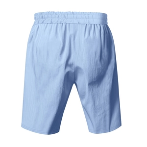 Detail of light blue linen shorts with elastic waistband and high-quality stitching