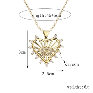 Gold heart-shaped evil eye pendant necklace with zircon detailing and size measurements