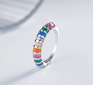 Close-up of S925 silver ring with rainbow rectangle cut crystals and a polished finish