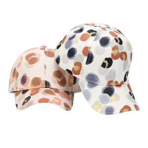 Women's curved brim baseball caps with abstract floral prints and sun protection