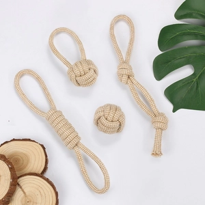 Detailed macro view of durable natural cotton rope pet chew toys in various knot shapes