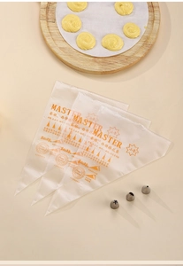Detailed view of clear disposable pastry bags with orange size markings on a wooden tray