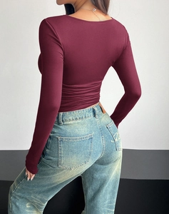 Slim fit long sleeve square neck top in burgundy red shown from the back with blue jeans