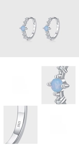 Close-up of S925 sterling silver hoop with blue opal and white zircon micro-setting