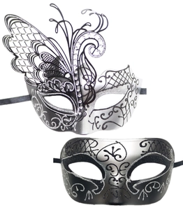 Detail of laser-cut butterfly masquerade masks with silver glitter and black ribbon ties