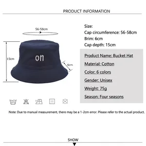 Navy cotton reversible bucket hat with letter embroidery for outdoor sun protection