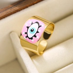 18K gold plated adjustable open ring with pink enamel evil eye in a beige jewelry box