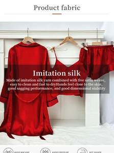 Detailed view of 3-piece red satin sleepwear set with robe, camisole and ruffle shorts